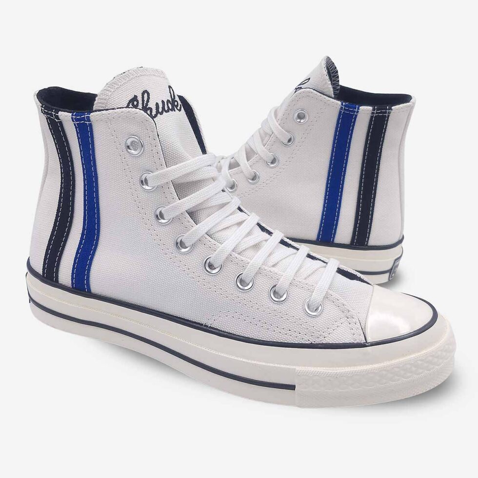 Mirrored pair of Converse Chuck 70 Vintage White boots showing premium canvas and side profiles.