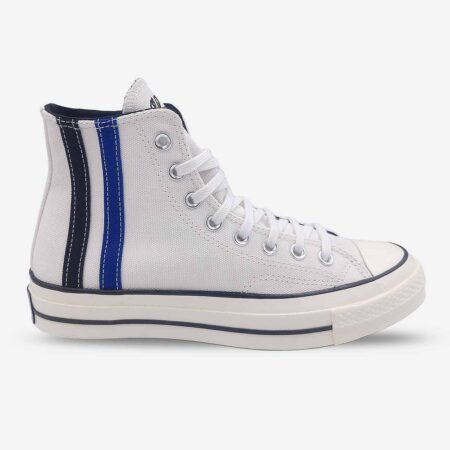 Side-front view of Converse Chuck 70 Vintage White high-tops in vintage white with Chuck Taylor branding on tongue and black & blue ankle stripes.