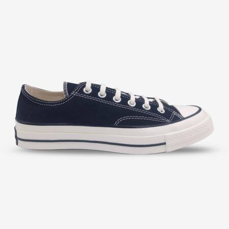 Side profile of Converse Chuck 70 Low Black sneakers highlighting reinforced foxing and lace-up design.
