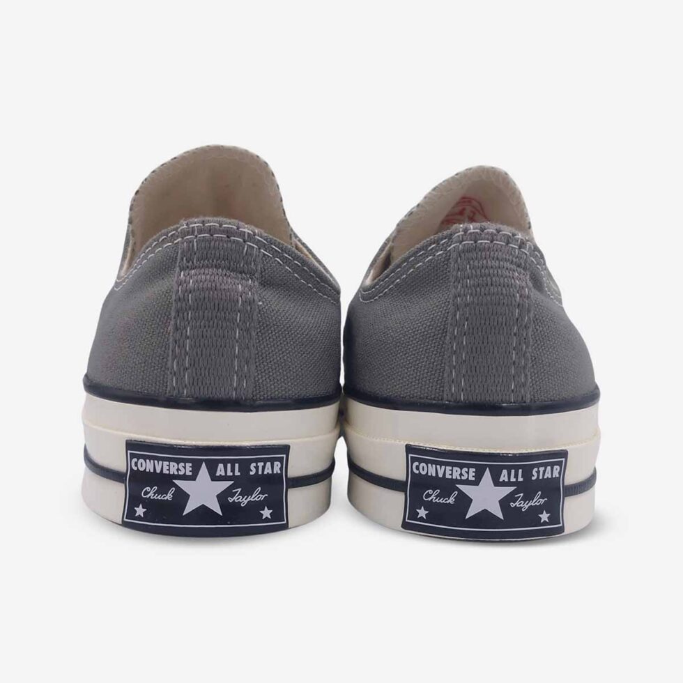 Back view of Converse Chuck 70 Low Grey sneakers highlighting the iconic “license plate” on the heel.