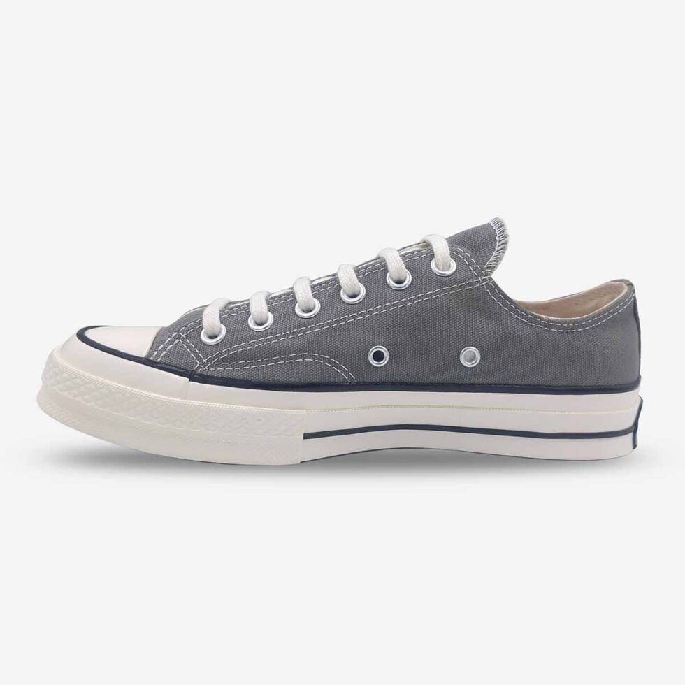 Inner side of Converse Chuck 70 Low Grey sneakers showing reinforced canvas and stitching.