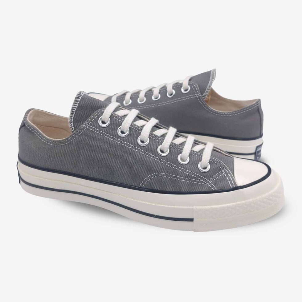 Mirrored pair of Converse Chuck 70 Low Grey sneakers highlighting clean lines and vintage-inspired design.