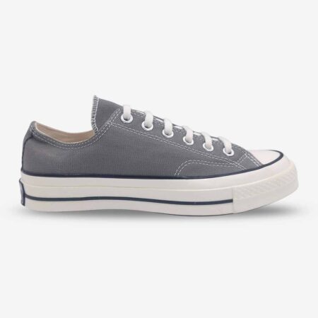 Side profile of Converse Chuck 70 Low Grey sneakers highlighting the taller foxing and lace-up design.