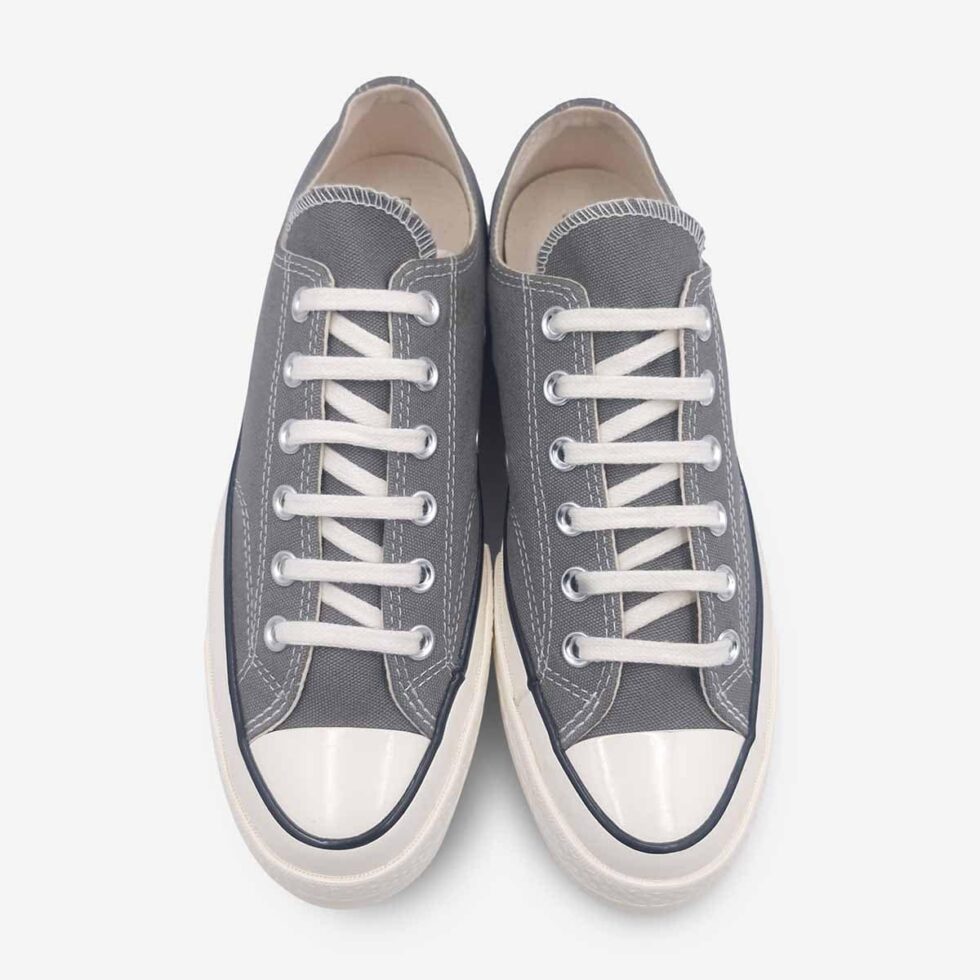 Top view of Converse Chuck 70 Low Grey showing lace-up closure and winged tongue stitching.