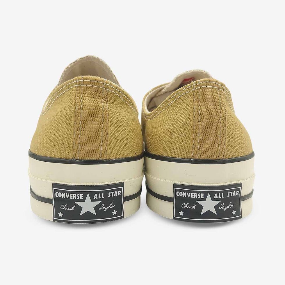 Back view of Converse Chuck 70 Low sneakers in a light khaki colour showing signature “license plate” on heel.