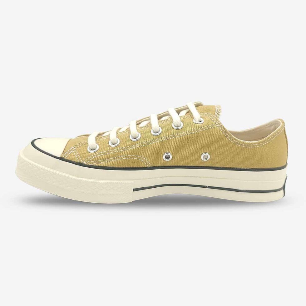 Inner side of Converse Chuck 70 Low sneakers in a light khaki colour.