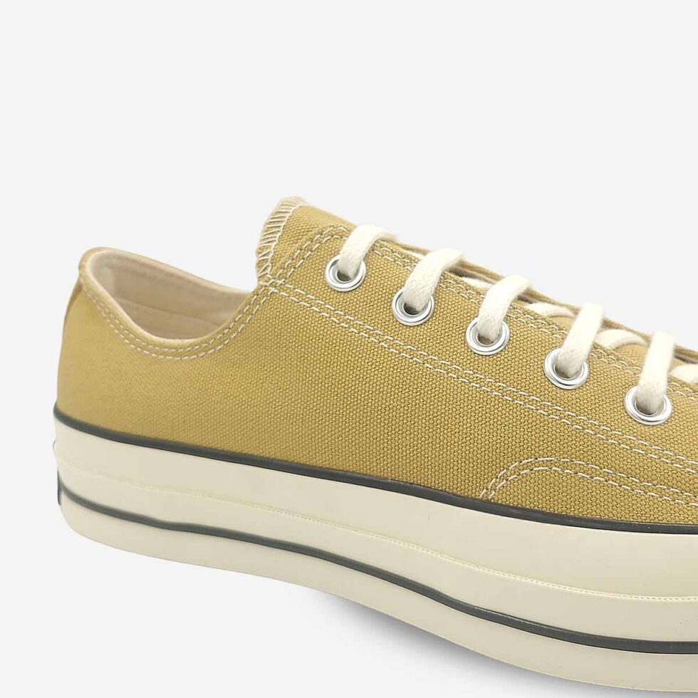 Close-up of Converse Chuck 70 Low sneakers in a light khaki colour.