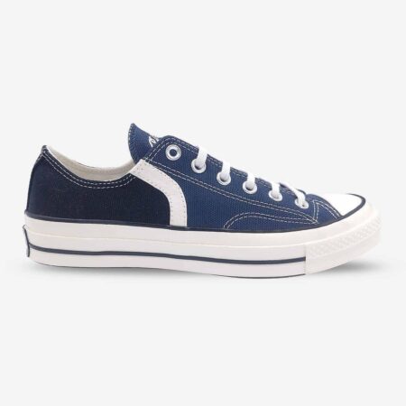 Side view of Converse Chuck 70 Low in navy and black sneakers.