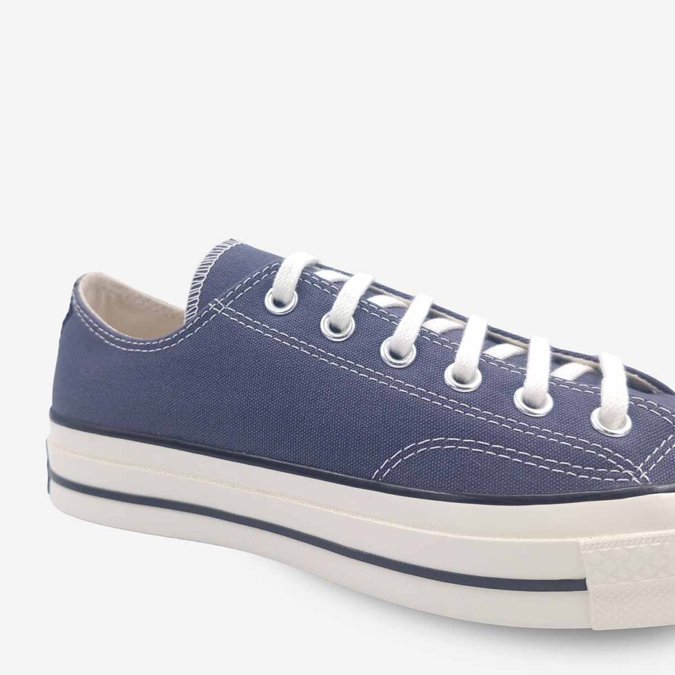 Close-up of Converse Chuck 70 Low Navy sneakers.