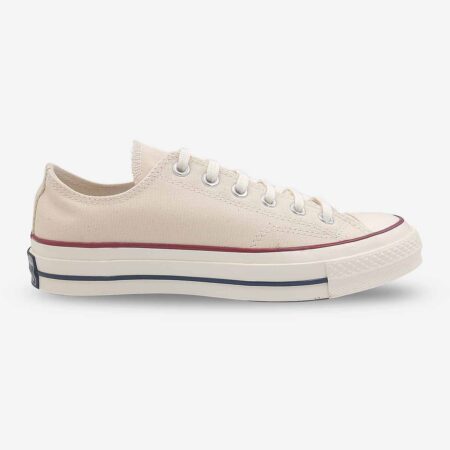 Side profile of Converse Chuck 70 Low Parchment White sneakers with reinforced foxing and lace-up design.