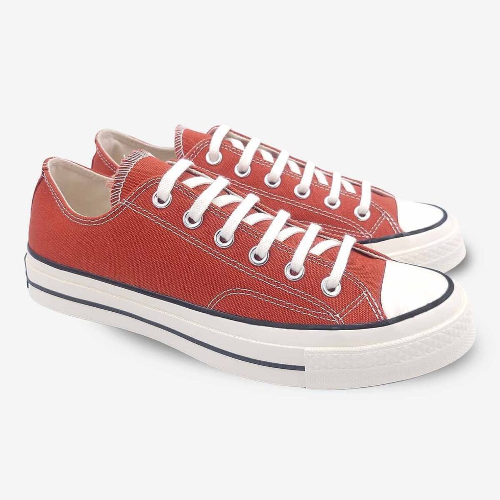 Angled pair of Converse Chuck 70 Low Red sneakers.