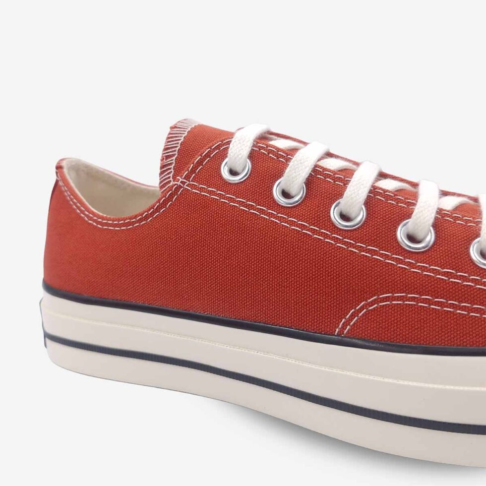 Close-up of Converse Chuck 70 Low Red sneakers.