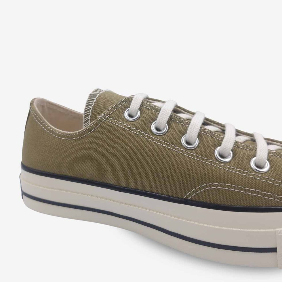 Close-up of Converse Chuck 70 Low sneakers in a taupe brown colour.