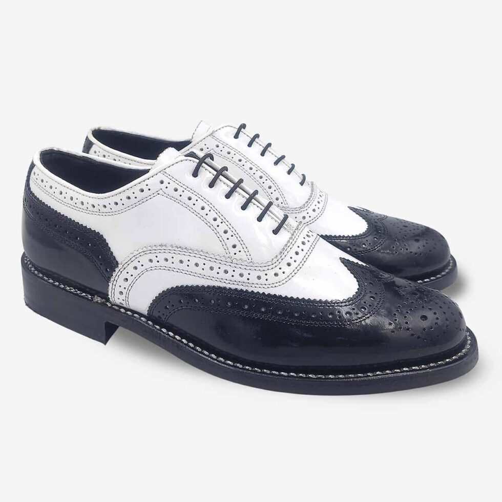 Angled view of Florsheim Cobbler Wingtip Shoes in black and white.