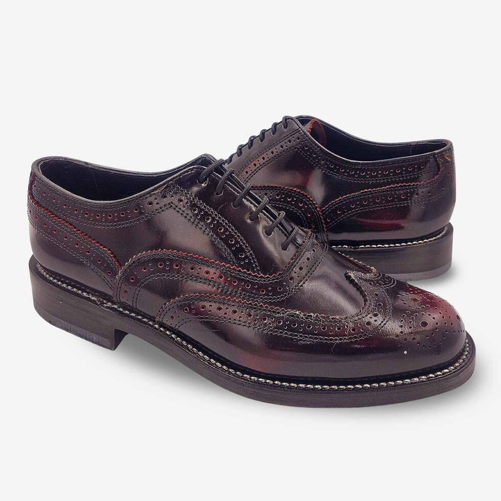 Mirrored pair of Florsheim Cobbler Wingtip Shoes in burgundy.