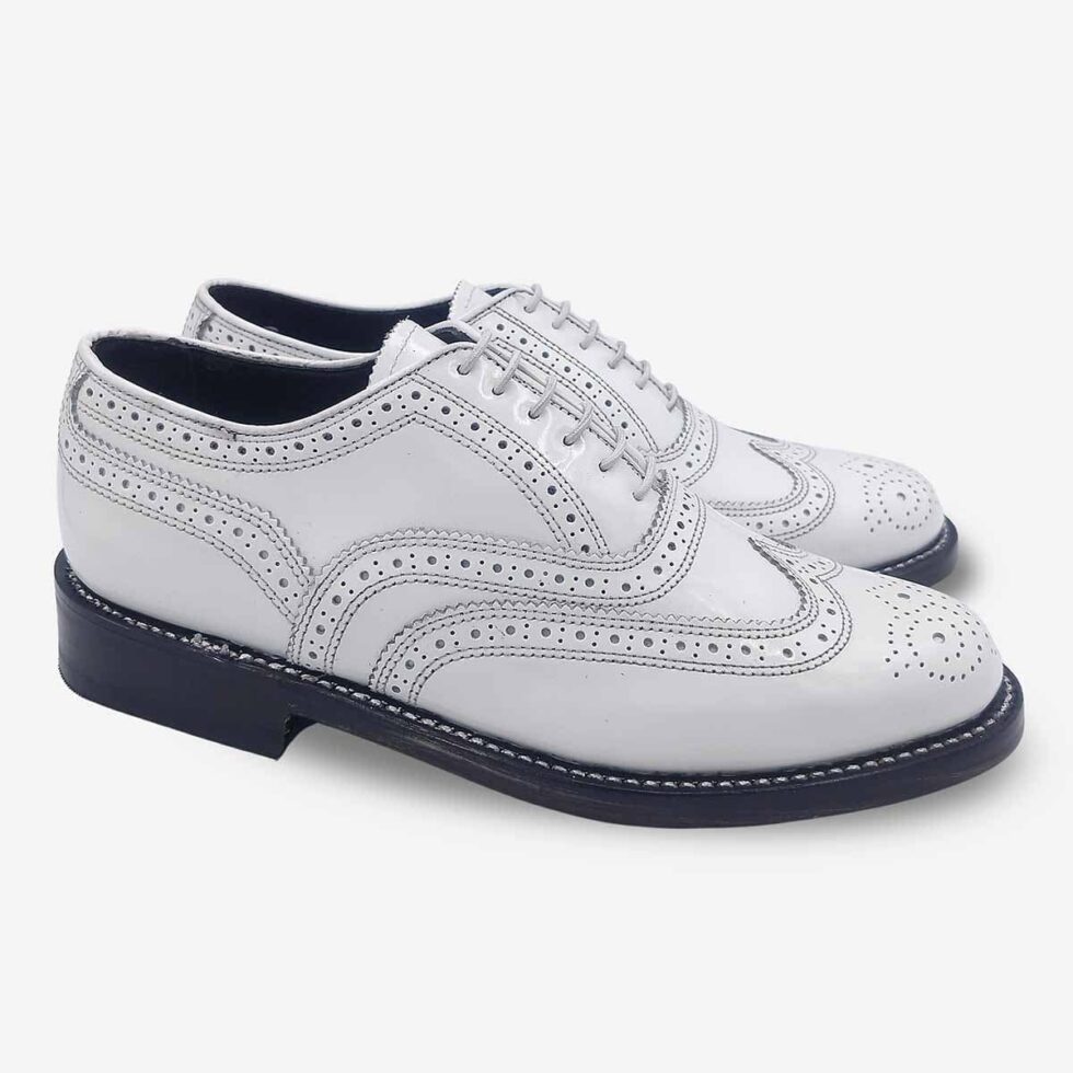 Angled view of Florsheim Cobbler Wingtip Shoes in white.