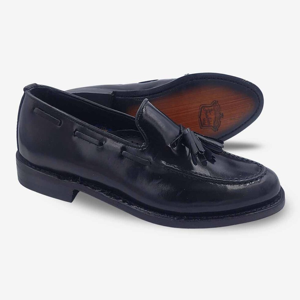Angled view showing sole of Florsheim Cobbler Tassel Loafers in Black.