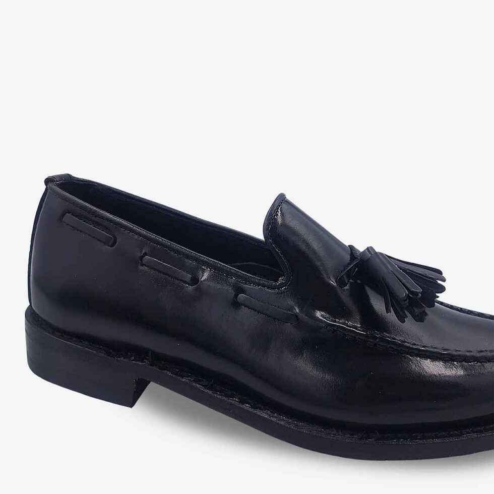 Close-up of Florsheim Cobbler Tassel Loafers in Black.