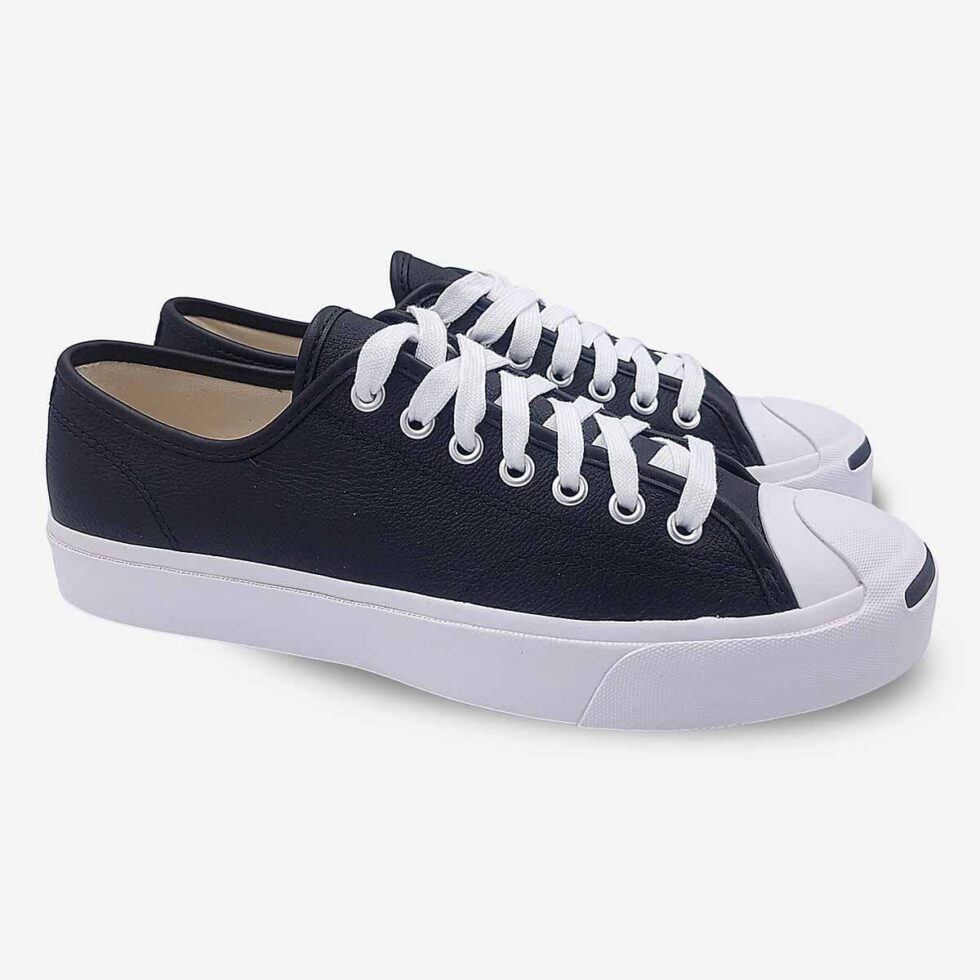 Angled pair of Jack Purcell low black leather sneakers with white sole