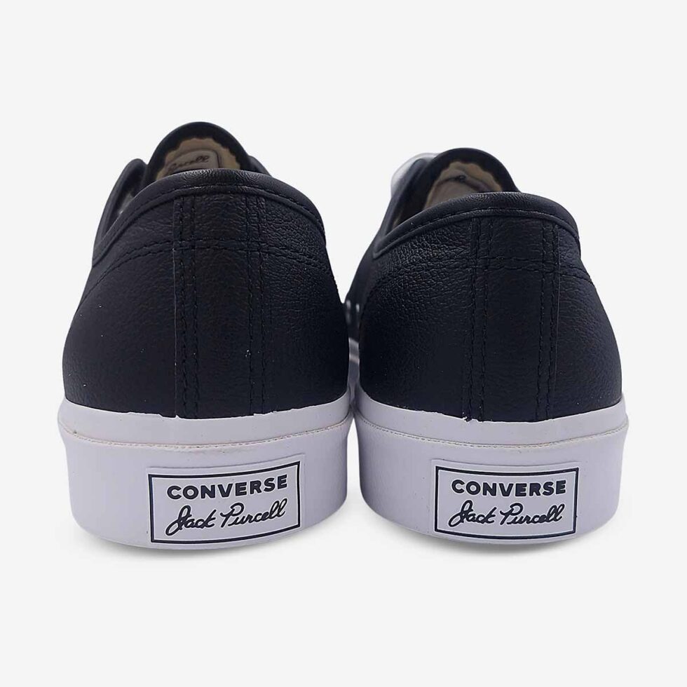 Back view of Jack Purcell low black leather sneaker showing heel branding in black leather