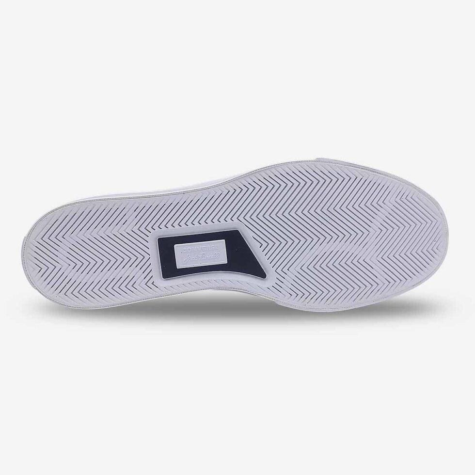 Underside view of Jack Purcell low black leather sneaker showing white rubber outsole
