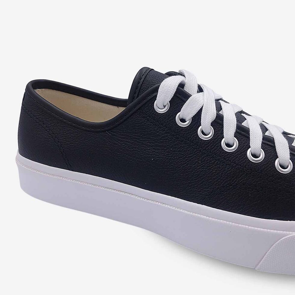 Close-up of Jack Purcell low leather sneaker in black colour showing smooth leather and stitch detailing