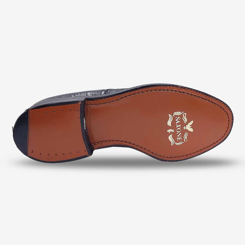 Underside of Saxone black textured lace-up with leather sole and branding