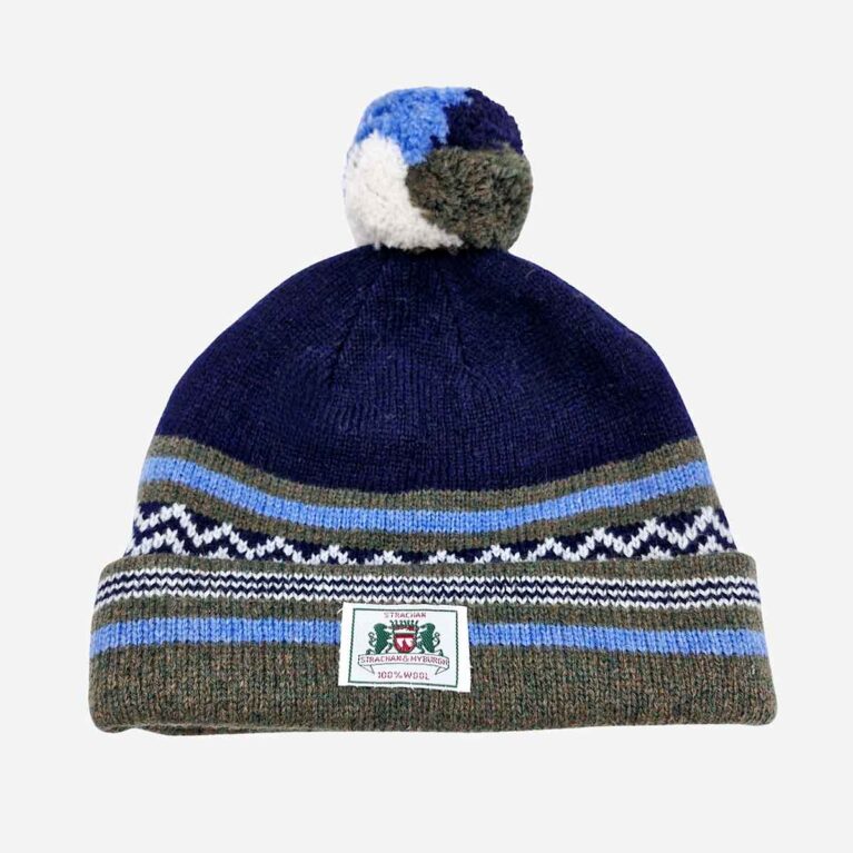 Top view of Strachan zigzag pattern wool beanie in dark blue, olive and light blue with front logo tab