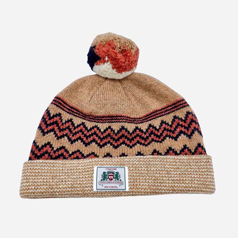 Top view of Strachan Beanie Brown in light brown, black and orange zigzag pattern with front logo tab