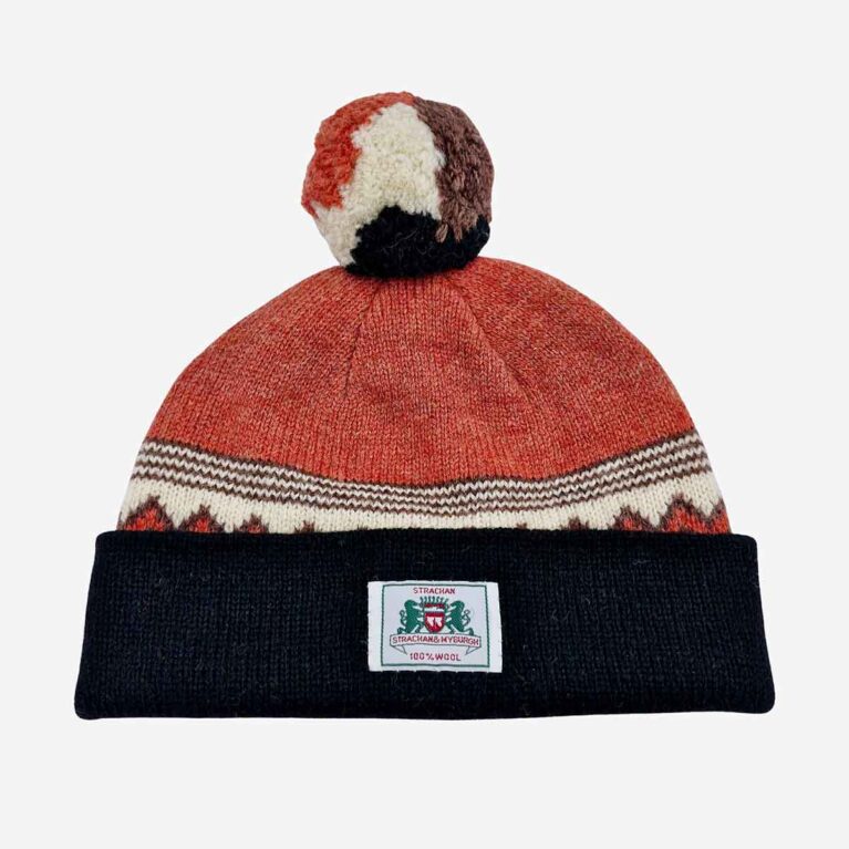 Top view of Strachan zigzag wool beanie in orange white and black with stitched front logo tab