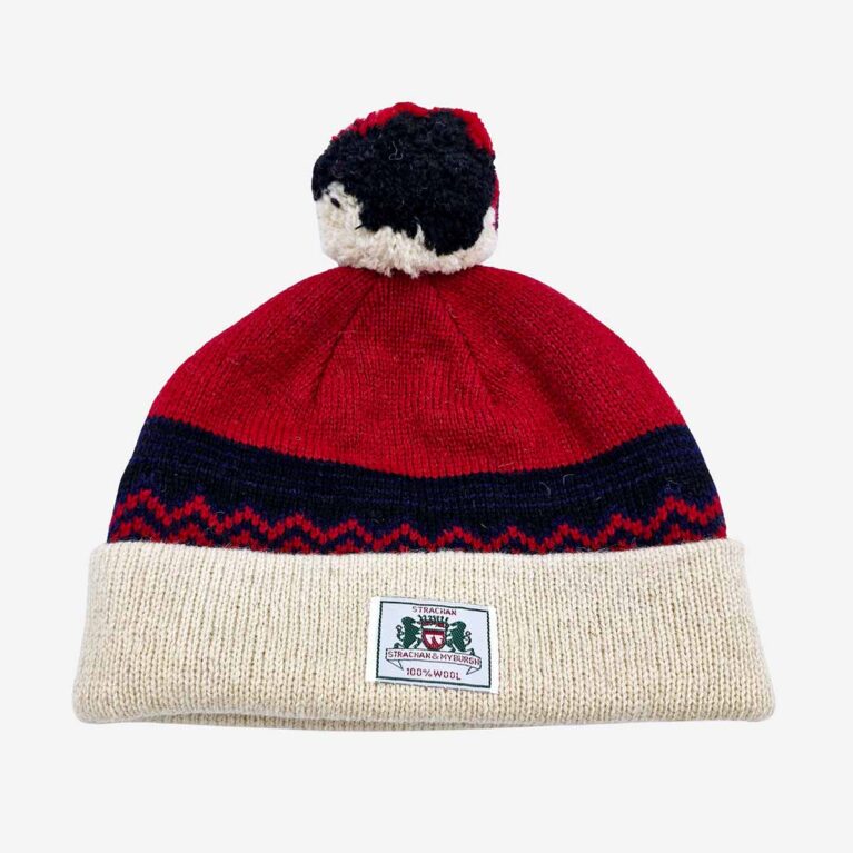 Top view of Strachan zigzag pattern wool beanie in red black and white with front logo tab