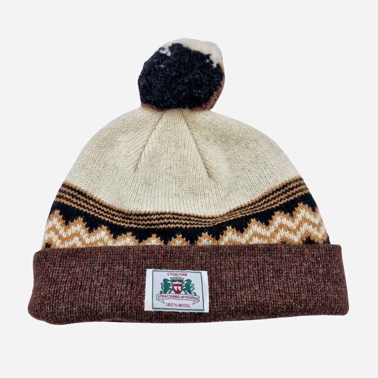 Top view of Strachan & Myburgh zigzag beanie in white black and dark brown with stitched front logo tab