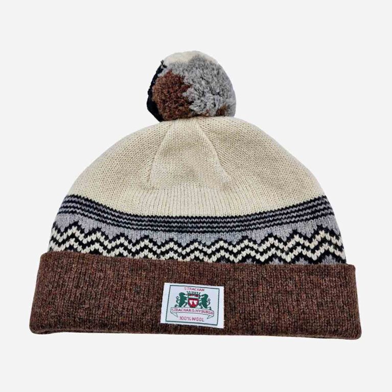 Top view of Strachan zigzag wool beanie in white, light grey and dark brown with front logo tab