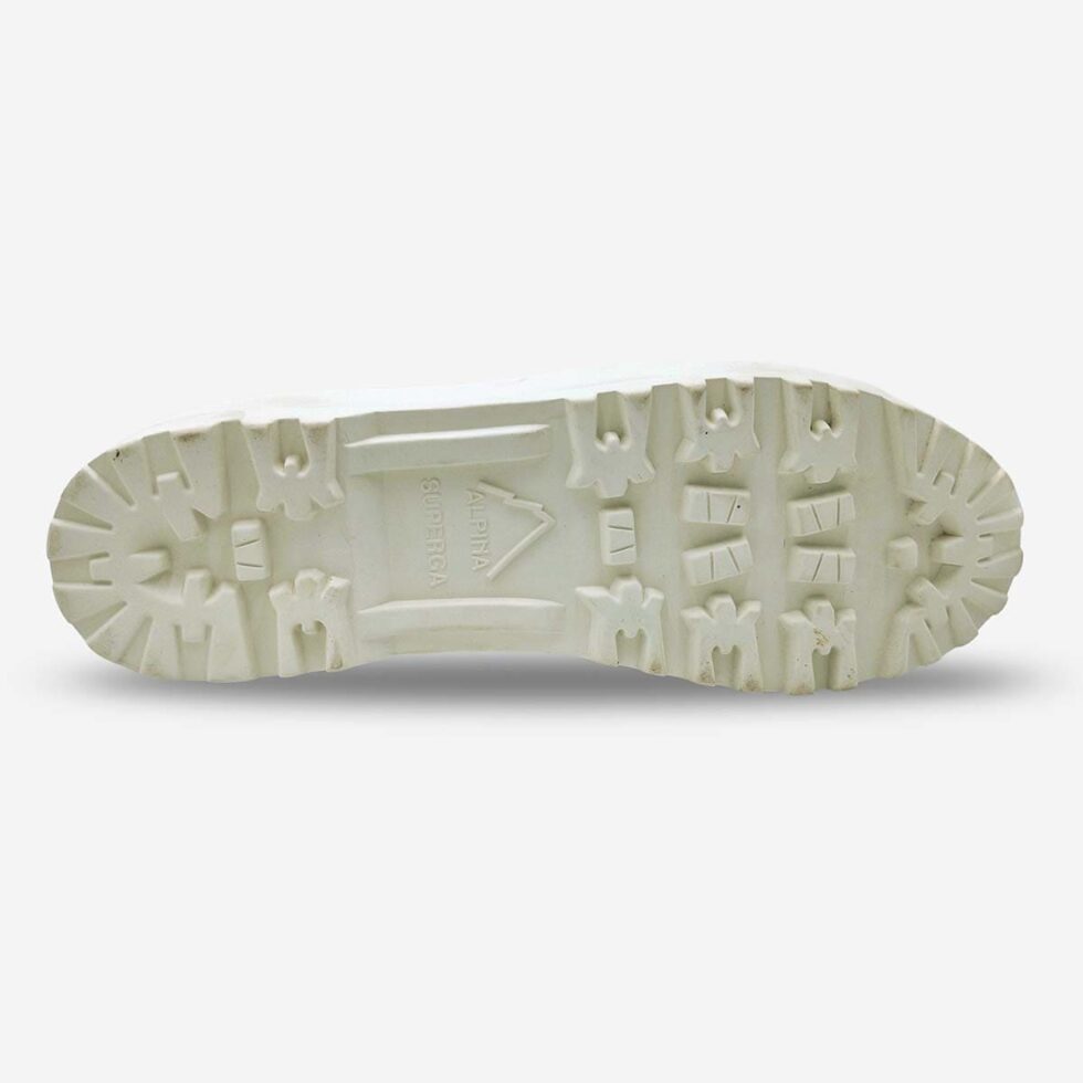 Vulcanised rubber lug sole of Superga 2341 Alpina white boot showing tread and durability