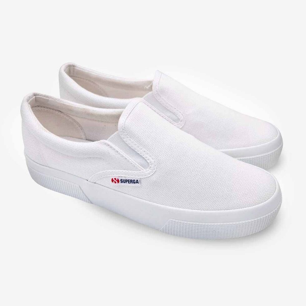 Pair of Superga 2740 white platform slip-on sneakers, angled view showing front and side