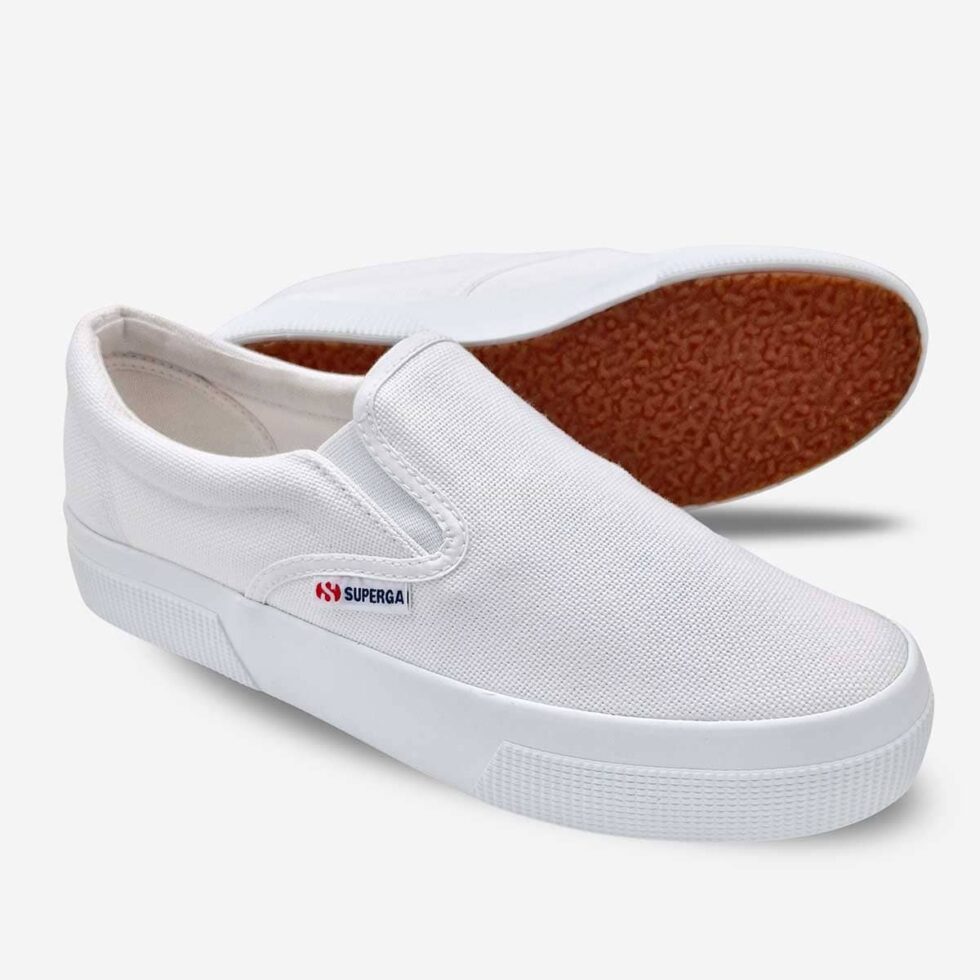 White Superga 2740 slip-on sneakers, angled pair showing rubber platform sole and canvas upper