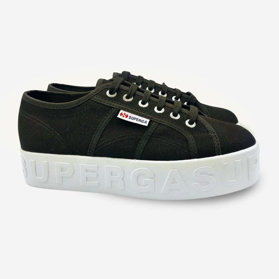 Pair of Superga 2790 black platform sneakers with shiny 3D lettering, angled front and side view