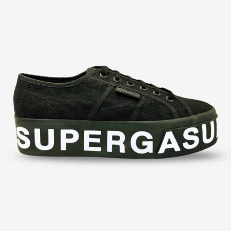Superga 2790 platform sneaker in black, side-front view with side tab and white lettering on sole